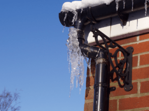 A frozen pipe outside the house in the Winter season